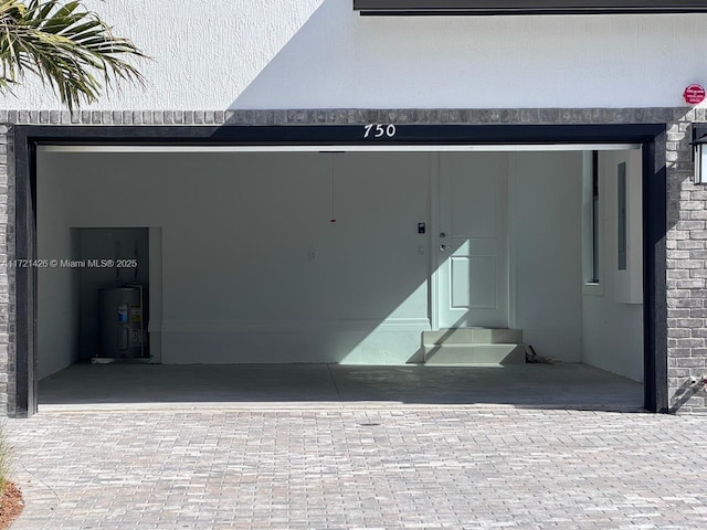 doorway to property featuring electric water heater