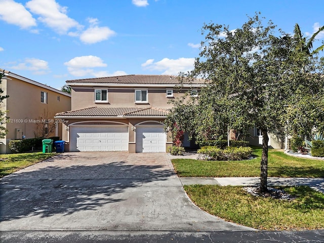 view of front facade featuring a front lawn and a garage