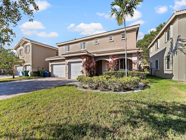 view of front of house with a front yard and a garage