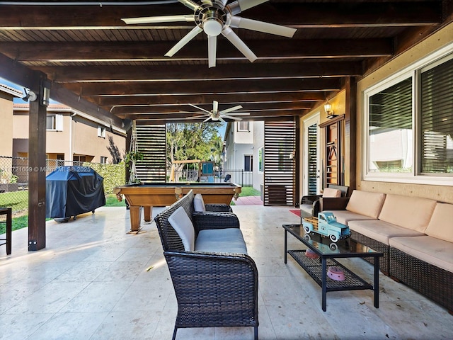 view of patio / terrace with area for grilling, ceiling fan, outdoor lounge area, and a bar