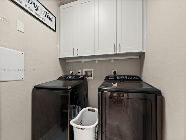 laundry room with cabinets and independent washer and dryer