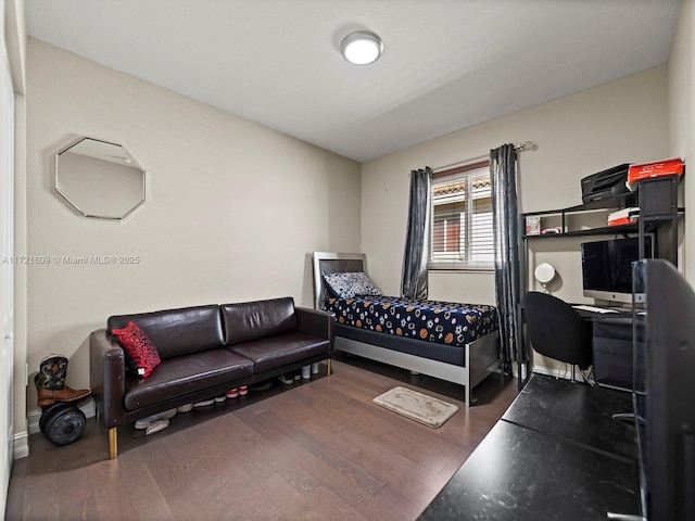 bedroom featuring dark hardwood / wood-style flooring