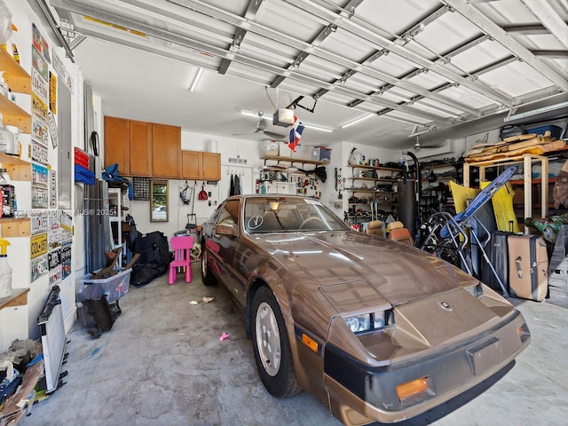 garage with ceiling fan and a garage door opener