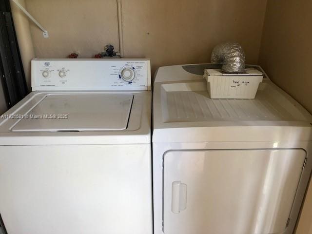 laundry room with separate washer and dryer