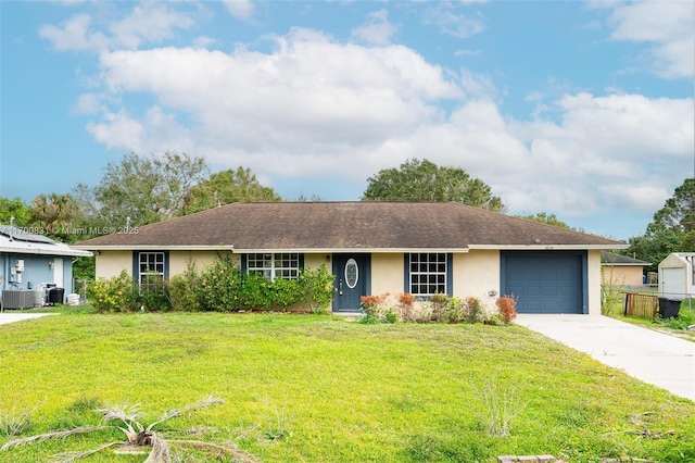 ranch-style home featuring a front lawn, central AC unit, and a garage