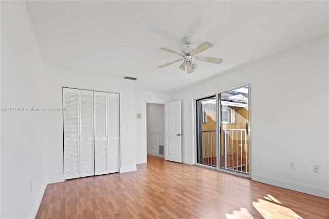 unfurnished bedroom with access to exterior, light hardwood / wood-style flooring, and ceiling fan