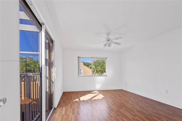 unfurnished room featuring hardwood / wood-style flooring and ceiling fan