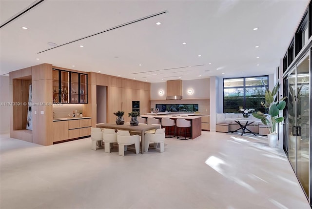 dining area featuring recessed lighting and finished concrete floors