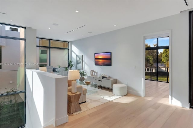 interior space featuring recessed lighting, light wood-style flooring, and baseboards