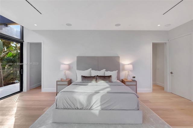 bedroom with access to exterior, light wood-type flooring, baseboards, and recessed lighting