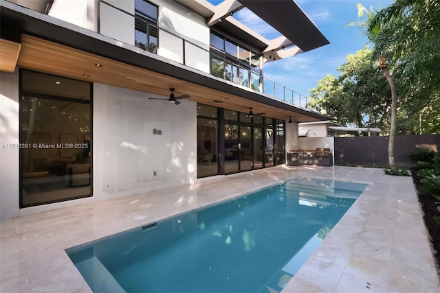 view of pool featuring a patio area and fence