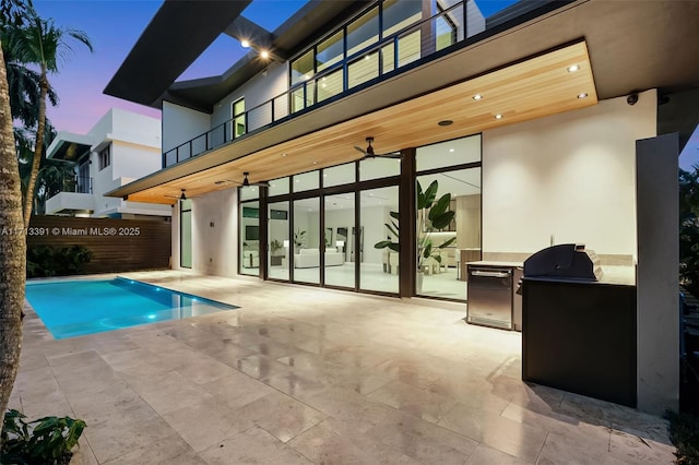 view of swimming pool featuring a fenced in pool, a patio area, and area for grilling