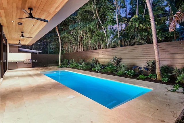 view of pool featuring a ceiling fan, a fenced backyard, and a patio