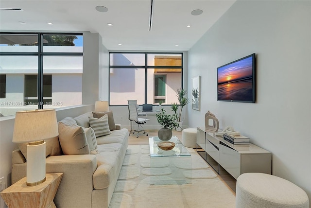 living room with wood finished floors and recessed lighting