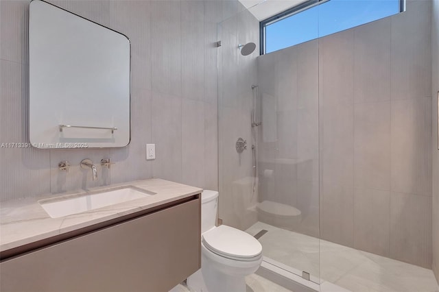 full bathroom with toilet, walk in shower, and vanity