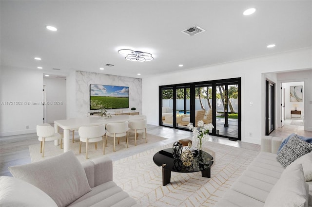 living room with french doors and light hardwood / wood-style floors