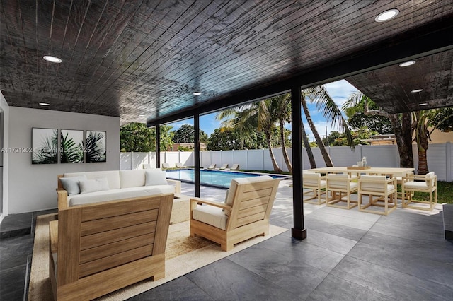 view of patio featuring a fenced in pool and an outdoor hangout area