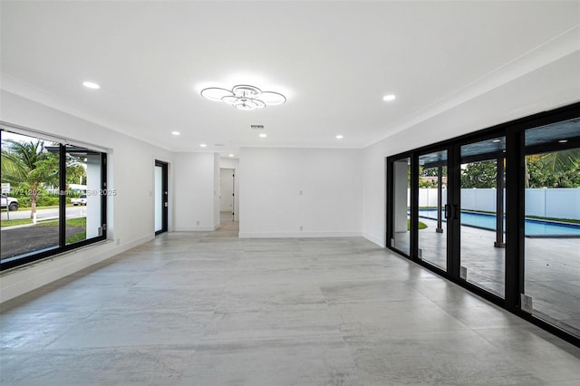 interior space with ornamental molding and french doors