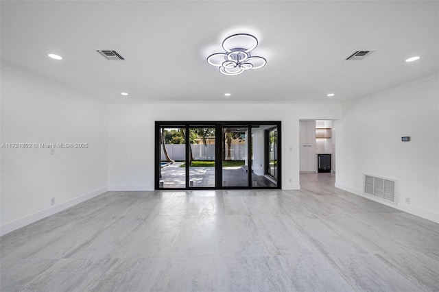 unfurnished room with crown molding and french doors