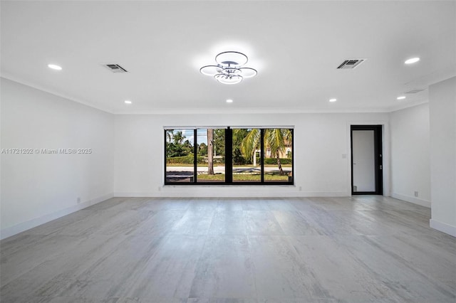 unfurnished room featuring crown molding