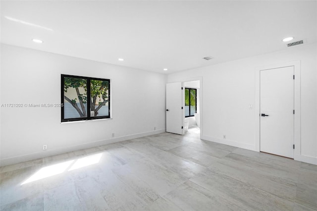 spare room featuring a wealth of natural light