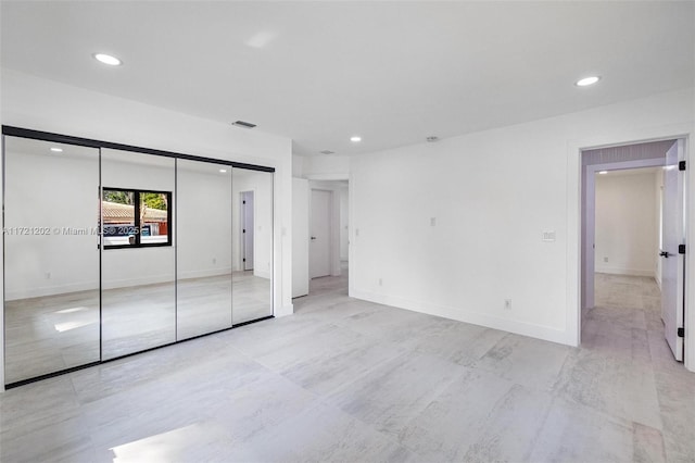 unfurnished bedroom featuring a closet