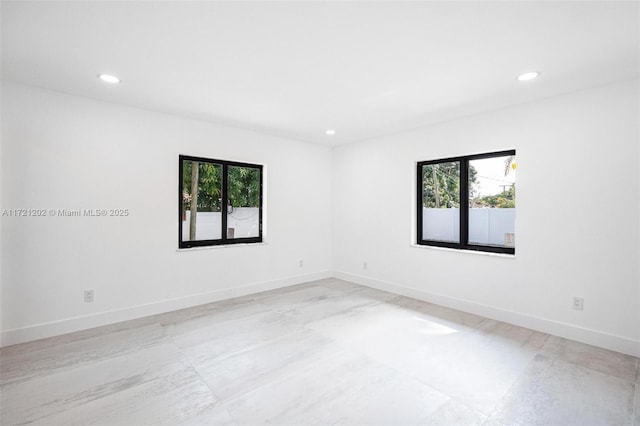 spare room with plenty of natural light