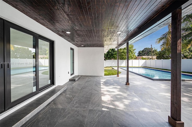 view of swimming pool with a patio