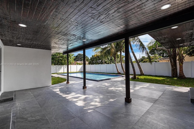 view of swimming pool with a patio