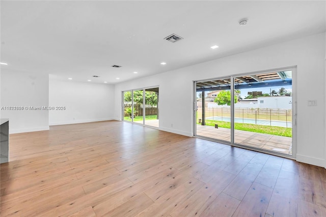 unfurnished room featuring light hardwood / wood-style floors