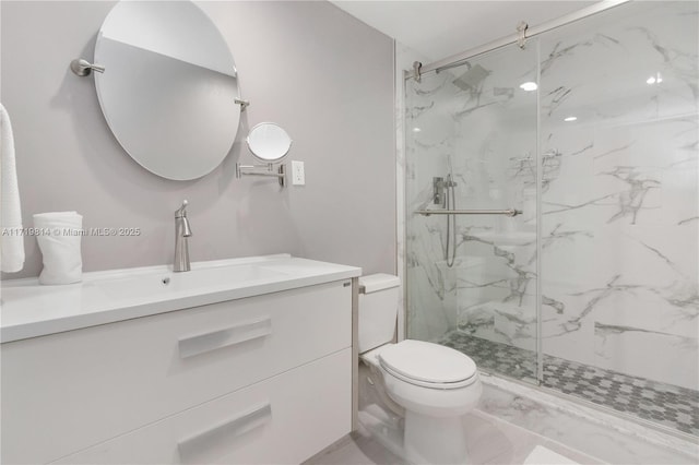 bathroom featuring vanity, toilet, and a shower with shower door