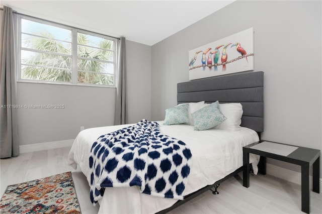 bedroom with hardwood / wood-style floors