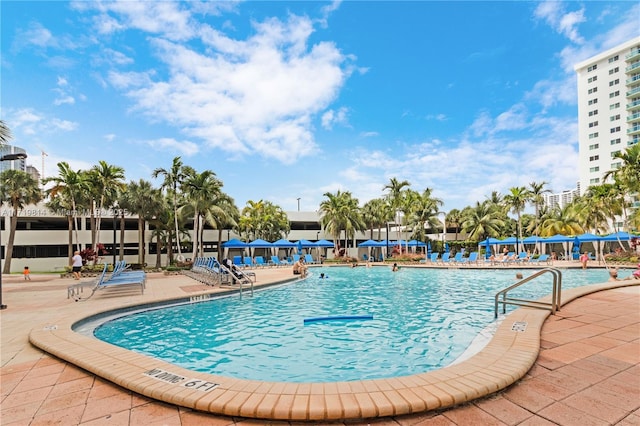 view of swimming pool featuring a patio area