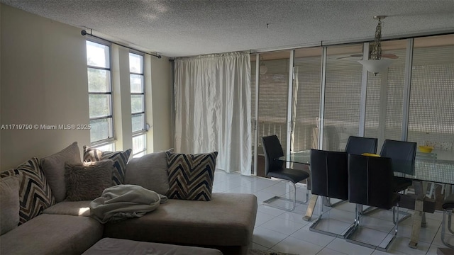 tiled living room with a textured ceiling