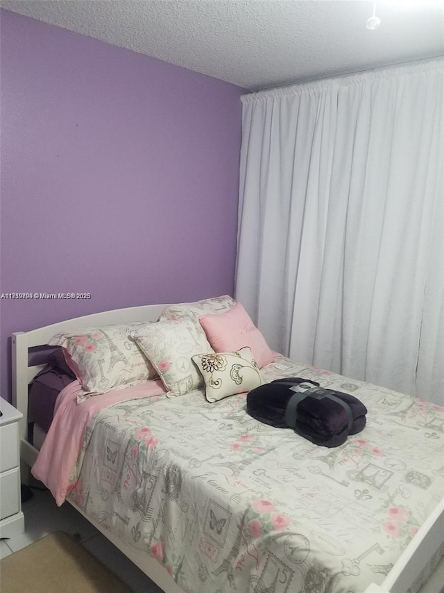 bedroom with a textured ceiling