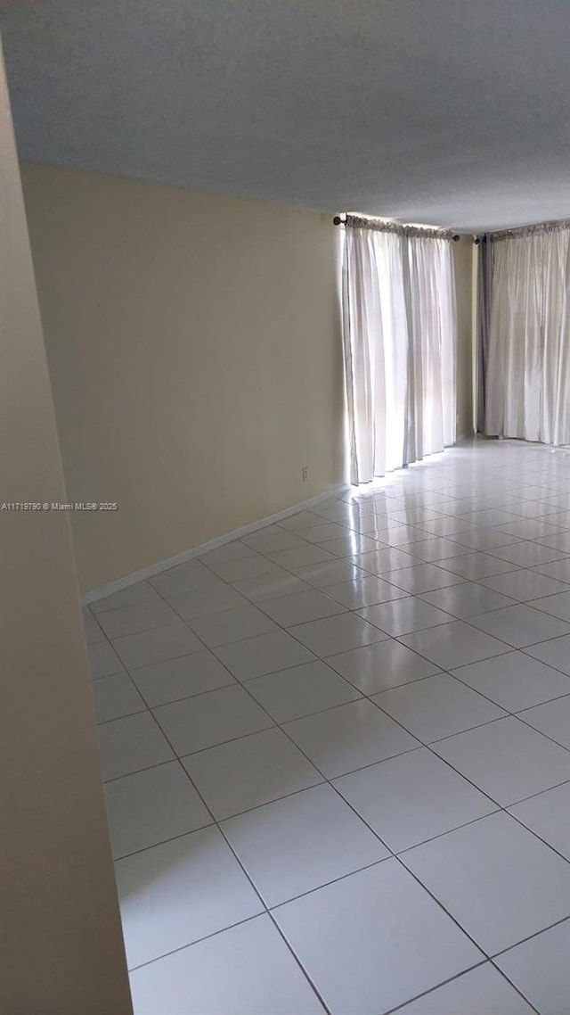 empty room featuring light tile patterned floors