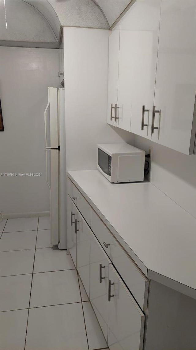 bathroom with tile patterned floors