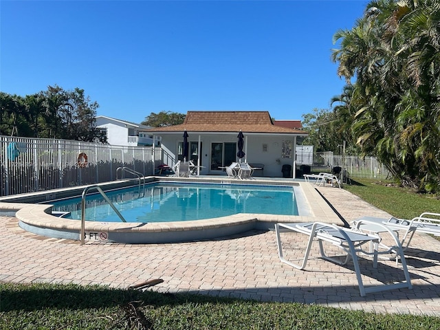 view of pool featuring a patio area and an outdoor structure