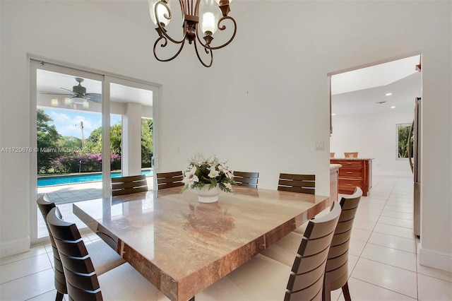 tiled dining area with ceiling fan