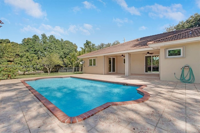 view of pool featuring a patio area and ceiling fan