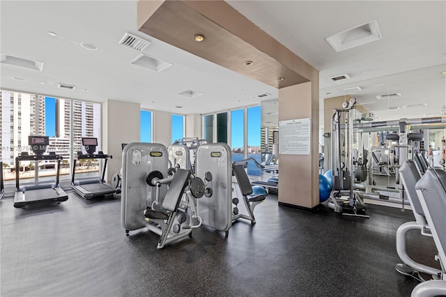 gym with a wall of windows and plenty of natural light