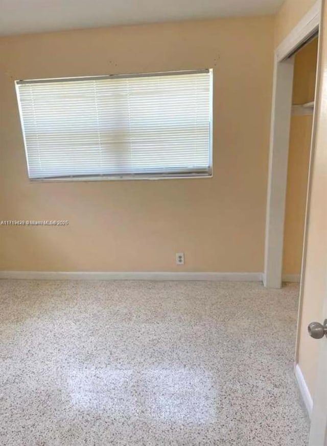 unfurnished bedroom with a closet