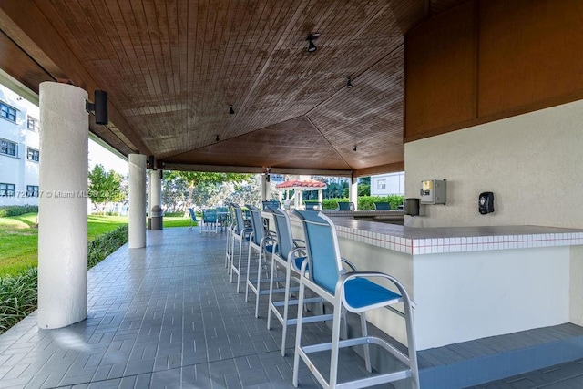 view of patio / terrace featuring an outdoor bar