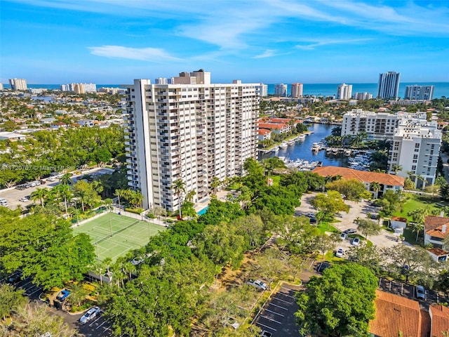 birds eye view of property with a water view