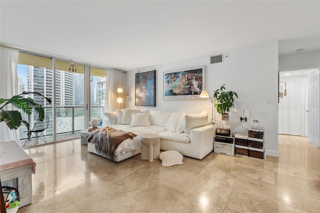 living room with floor to ceiling windows