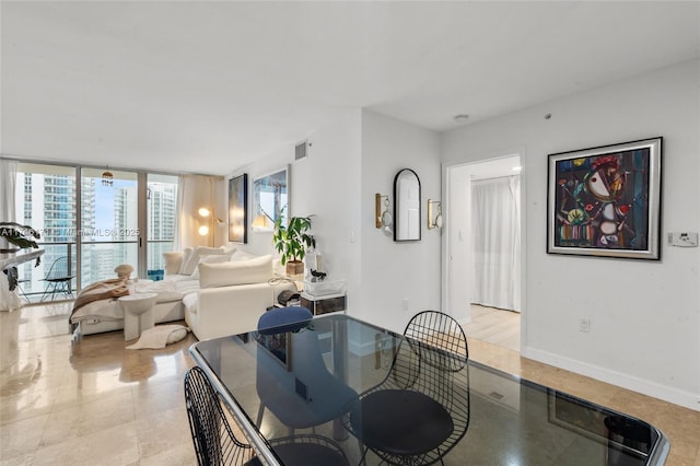 dining space with expansive windows