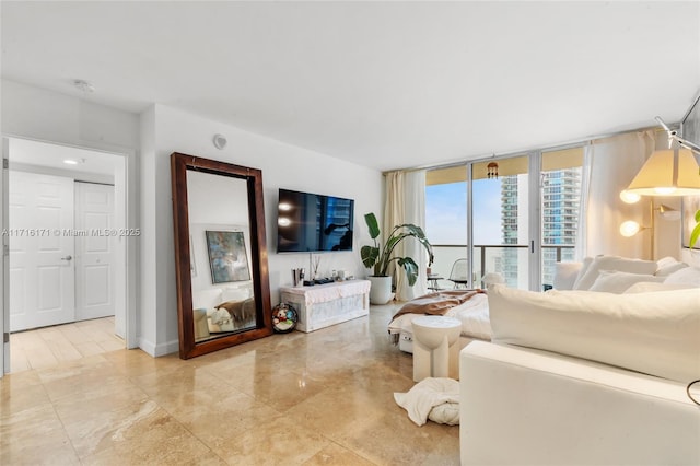 living room featuring floor to ceiling windows