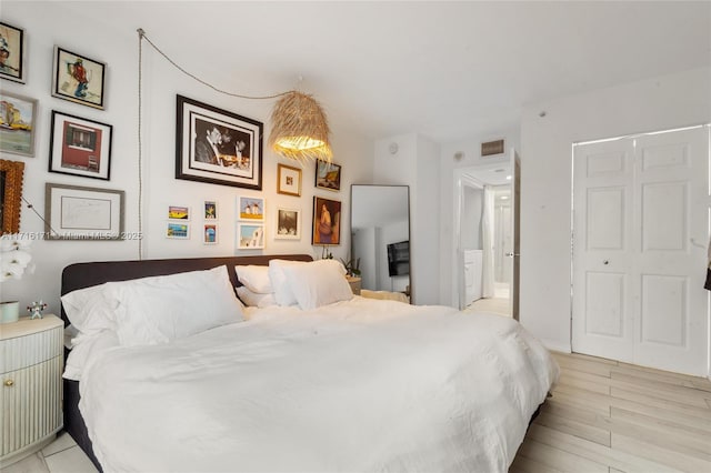 bedroom with light wood-type flooring