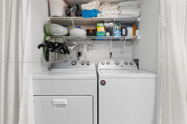 laundry room featuring separate washer and dryer