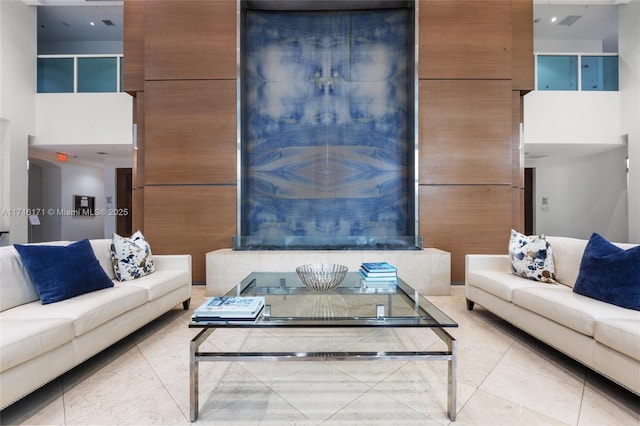 living room featuring a towering ceiling